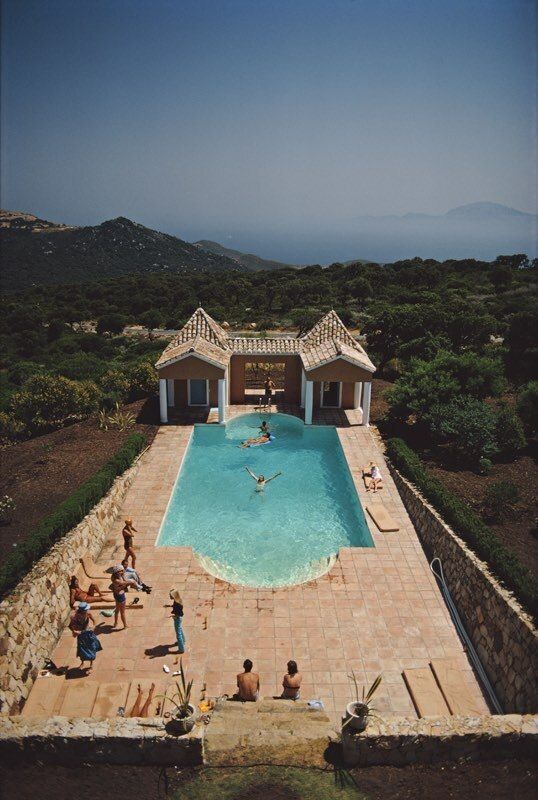 Slim Aarons 'Pool At El Cuarton' Framed White