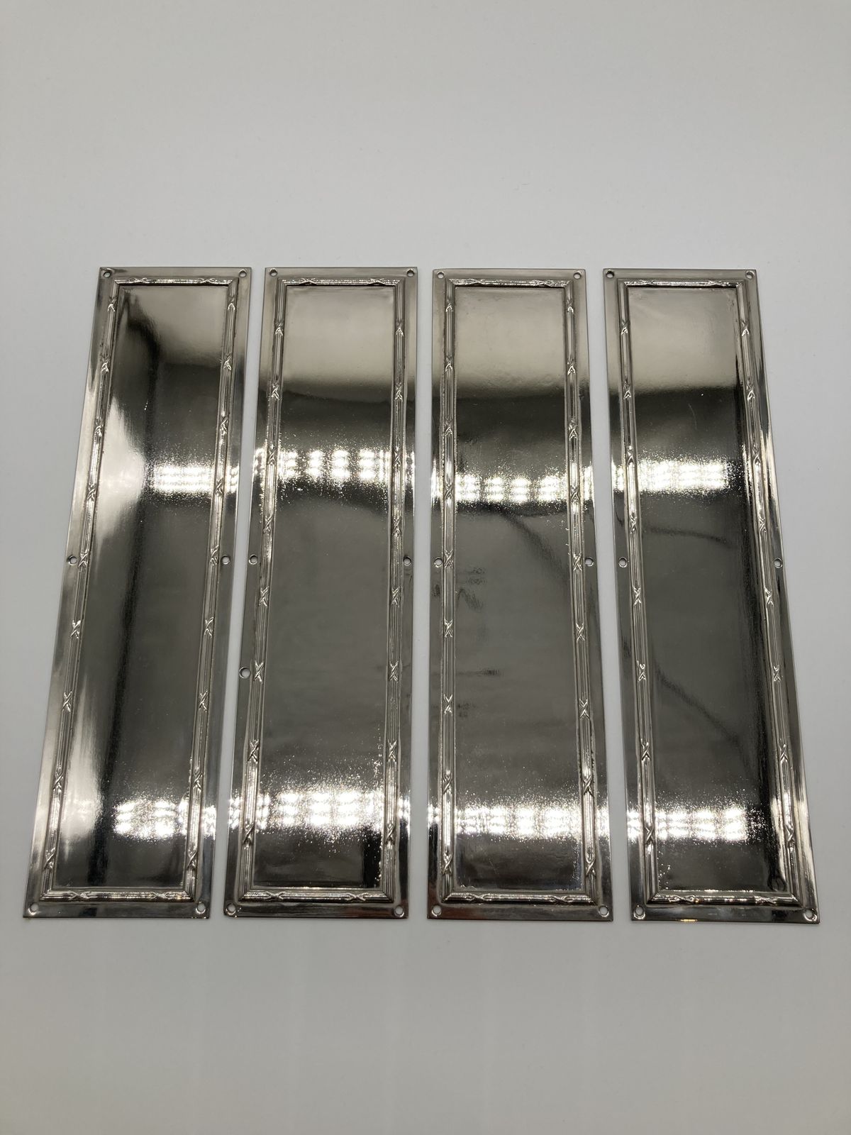 Set Of Four Chrome Nickel Plated Ribbon And Tie Finger Plates