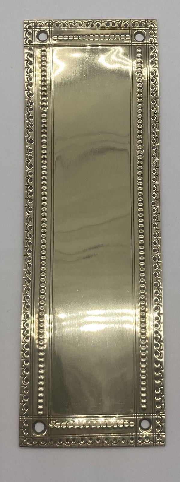 Set Of Ten Small Brass Finger Plates With Pipping And Wavy Pattern To Edge photo furniture