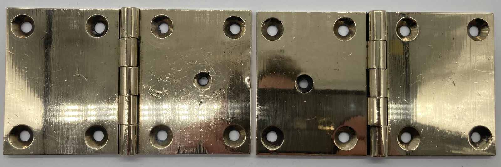 A Pair Of Square Brass Door Hinges photo furniture