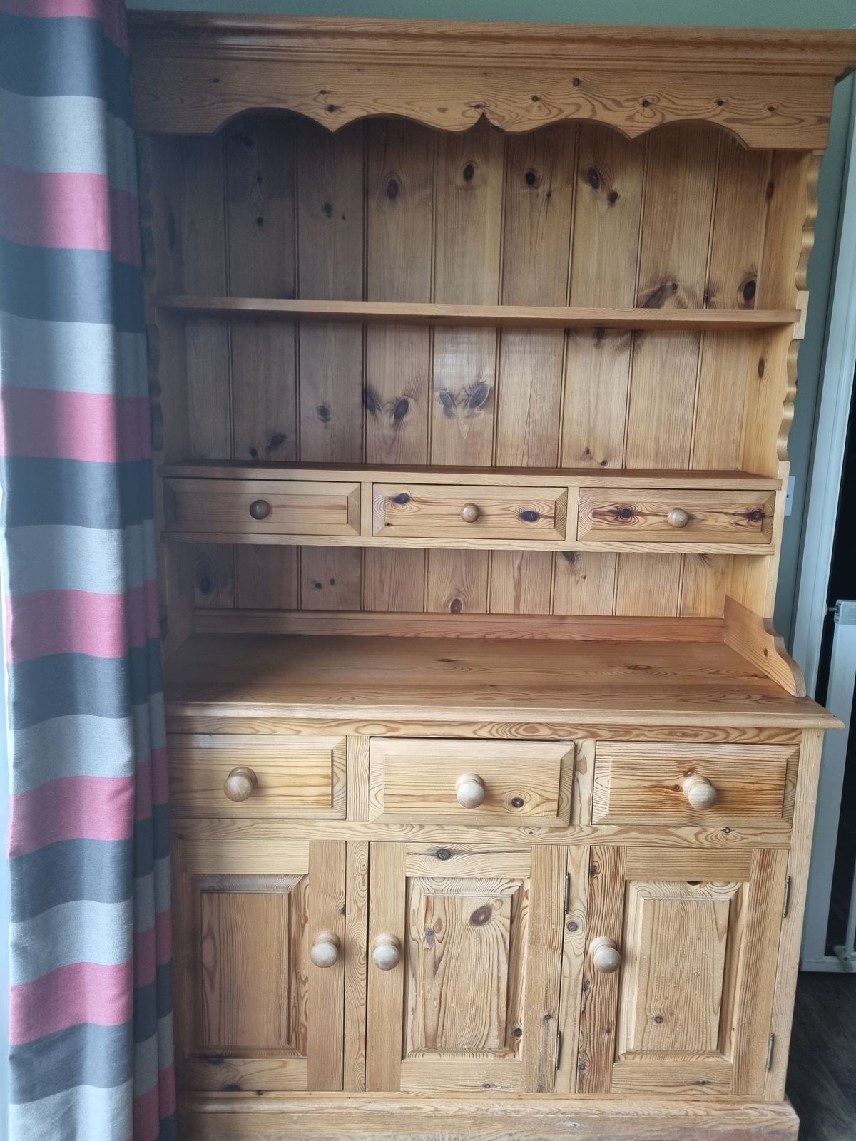 Traditional Pine Dresser, Very Well Made, Solid And In Good Condition. Comprises Of 2 Upper Shelves, 6 Draws And Large Base Cupboad For Storage. The Top Comes Off The Base For Easier Transportation.