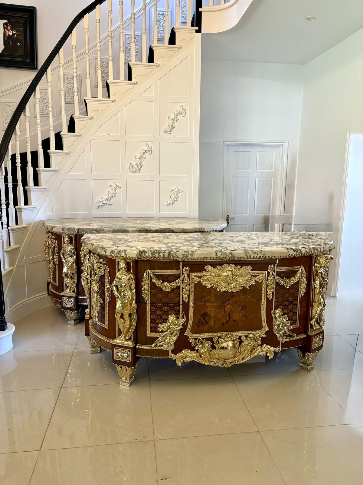 Antique Rare Fine Pair Of French Marquetry And Gilt Bronze Mounted Commodes In The Louis XVI Style, After Jean Henri Riesener