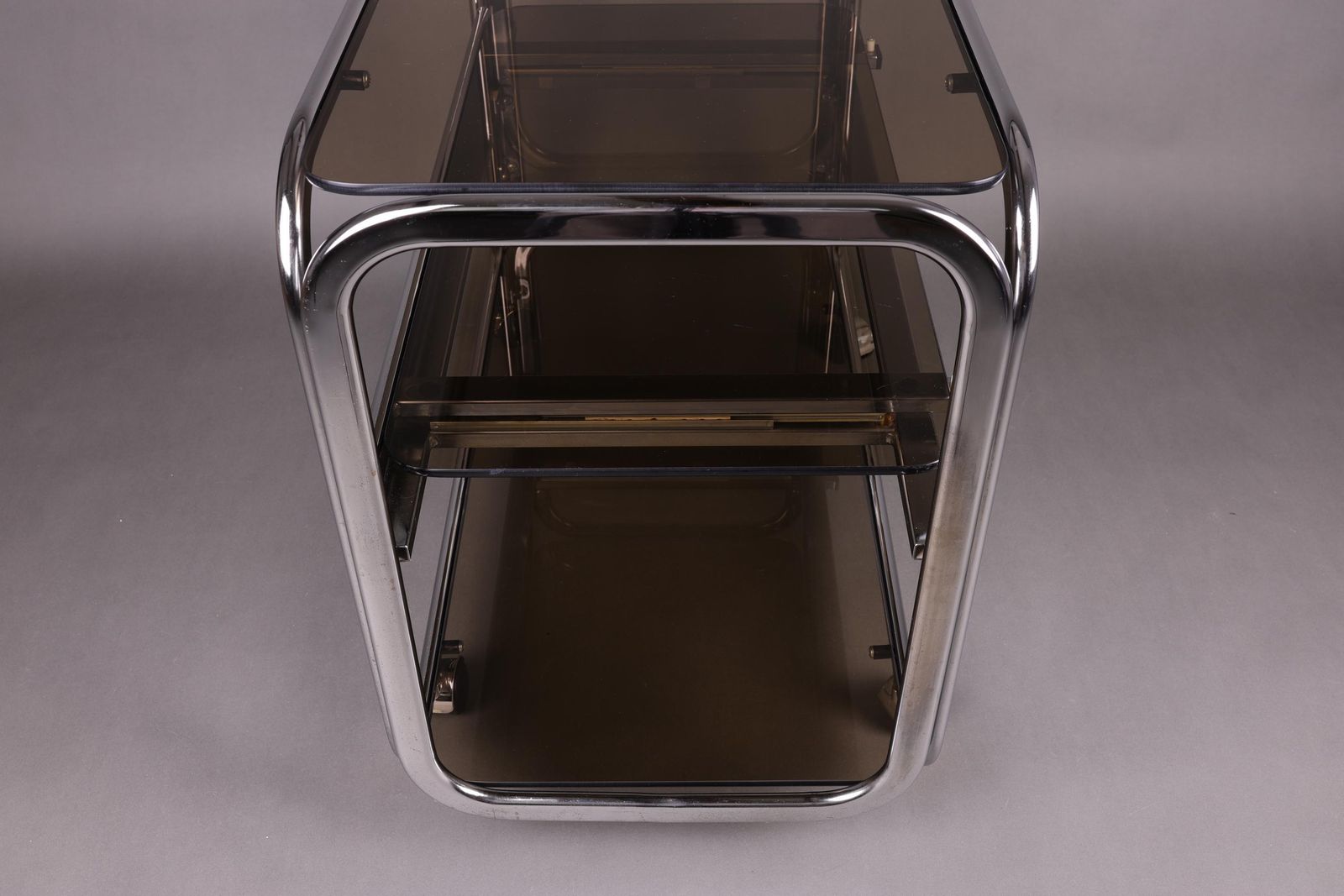1970s Smoked Glass Side Table | Chrome Rolling Console | Vintage Mid Century Modern Trolley | Vintage Glam Accent Table For Living Room photo vinterior