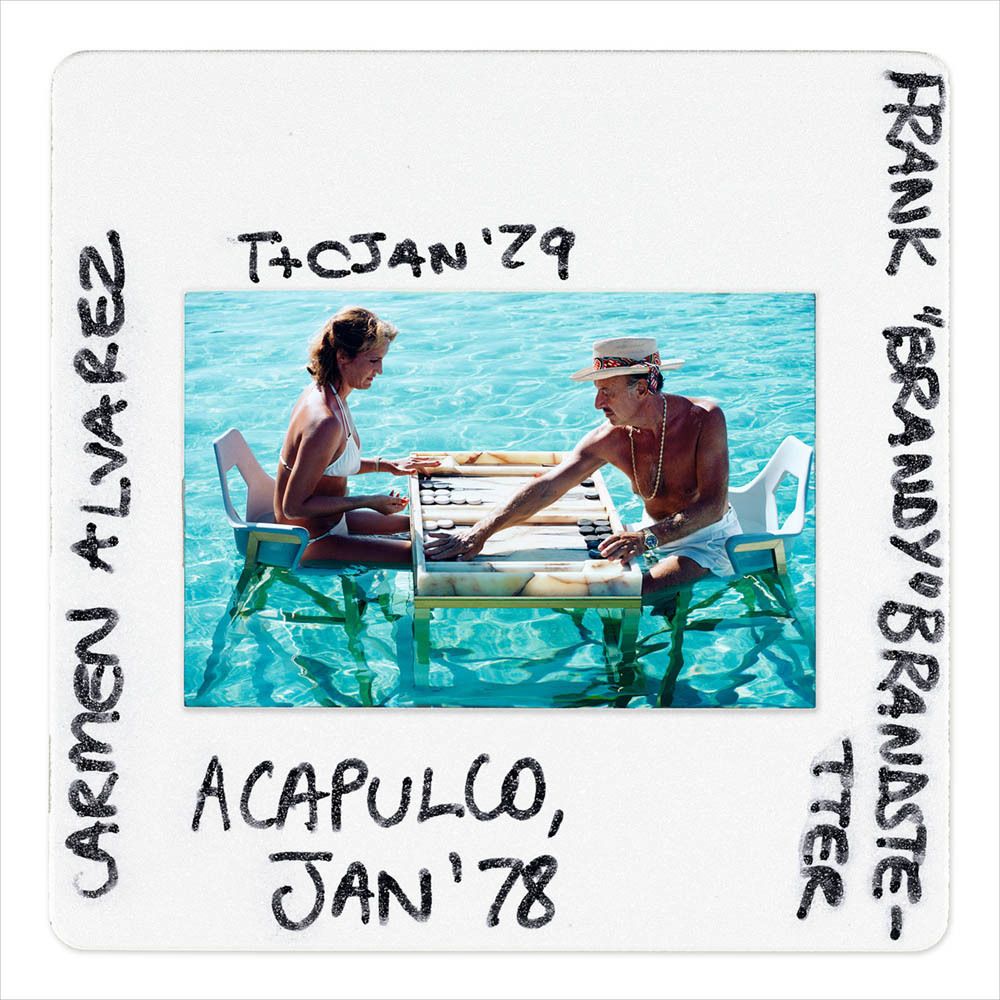 Slim Aarons 'Keep Your Cool Slide' Framed White
