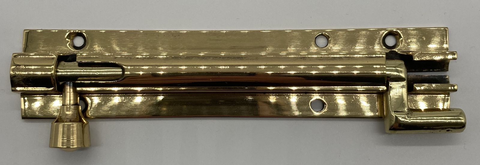 A Small Brass Crank Door Bolt, 1920s