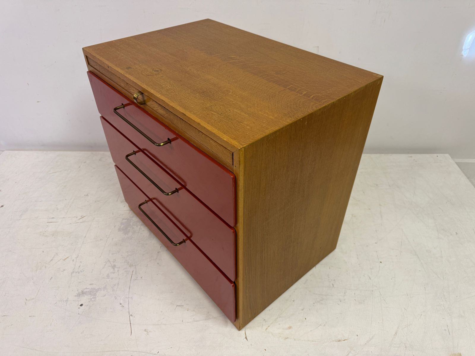 1960s Red Chest Of Drawers With Pull Out Slide By Heals photo for sale