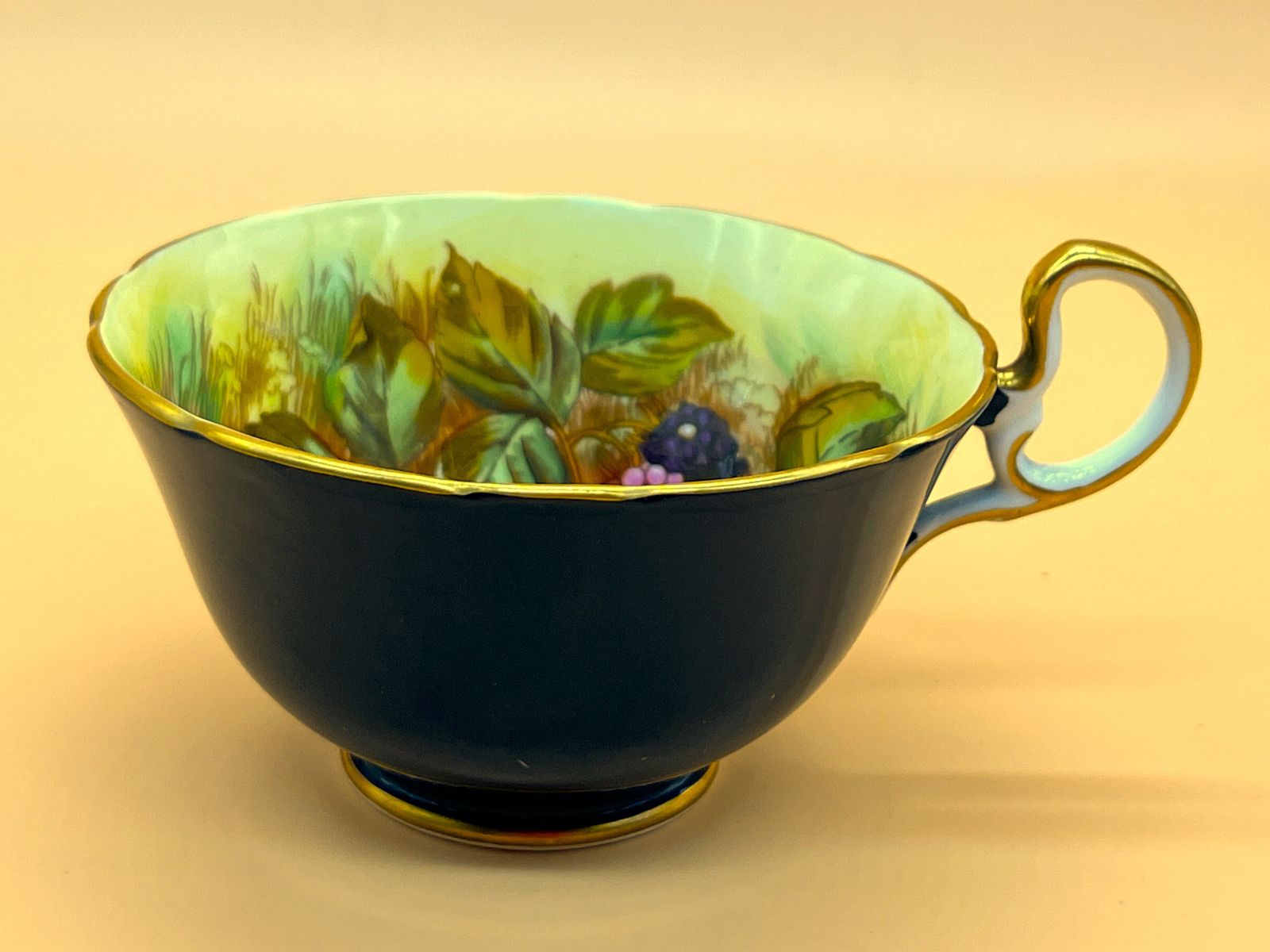Aynsley China Orchard Gold Fruit Signed D Jones High Doris Shape Black And Gold Cabinet Tea Cup & Saucer Duo. C1952 63. photo vintage