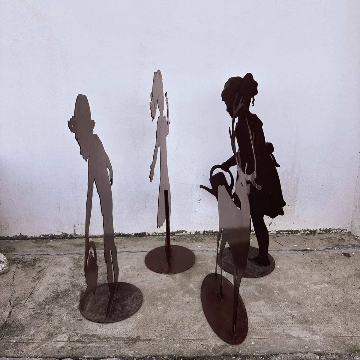 Silhouettes Of Children And A Deer In Iron, A Unique Decoration To Embellish Gardens And Open Spaces photo for sale