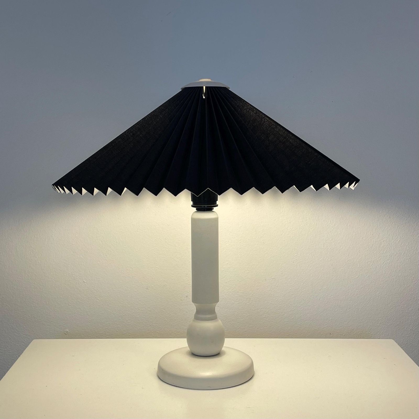 Danish Vintage Mid Century Modern Design Table Lamp With White Wooden Base And Black Pleated Fabric Shade With Cool Plastic Top
