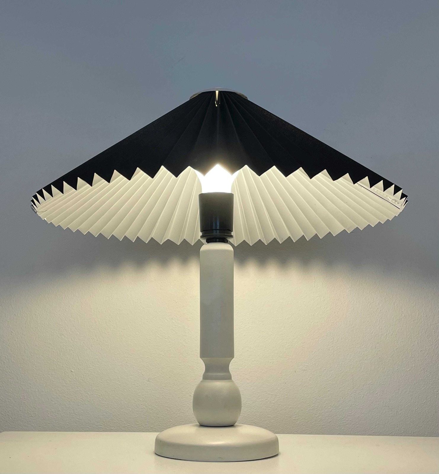 Danish Vintage Mid Century Modern Design Table Lamp With White Wooden Base And Black Pleated Fabric Shade With Cool Plastic Top photo furniture