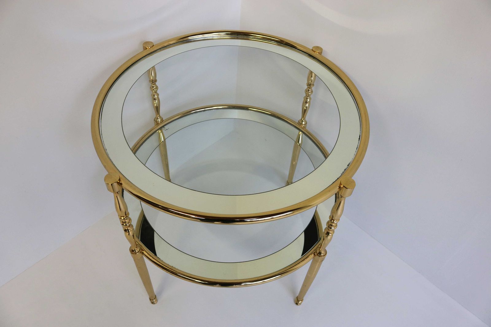 Round Brass Side Table With Glass Shelves Surrounded By A Silvered Mirror French. Circa 1970 Hollywood Regency Golden Coffee Table End Table photo for sale
