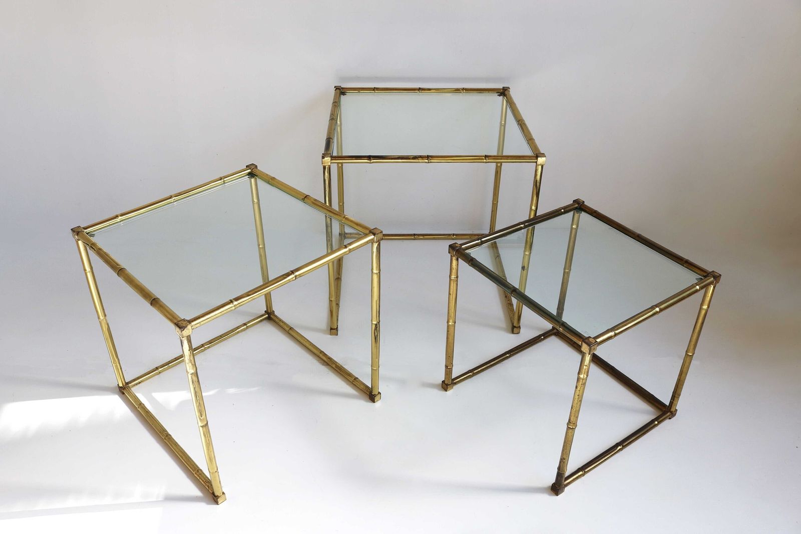 Brass Faux Bamboo Italian Mid Modern Nesting Tables Glass Tops Vintage Side Tables Nest Of Three Occasional Tables Hollywood Regency 1970s photo for sale