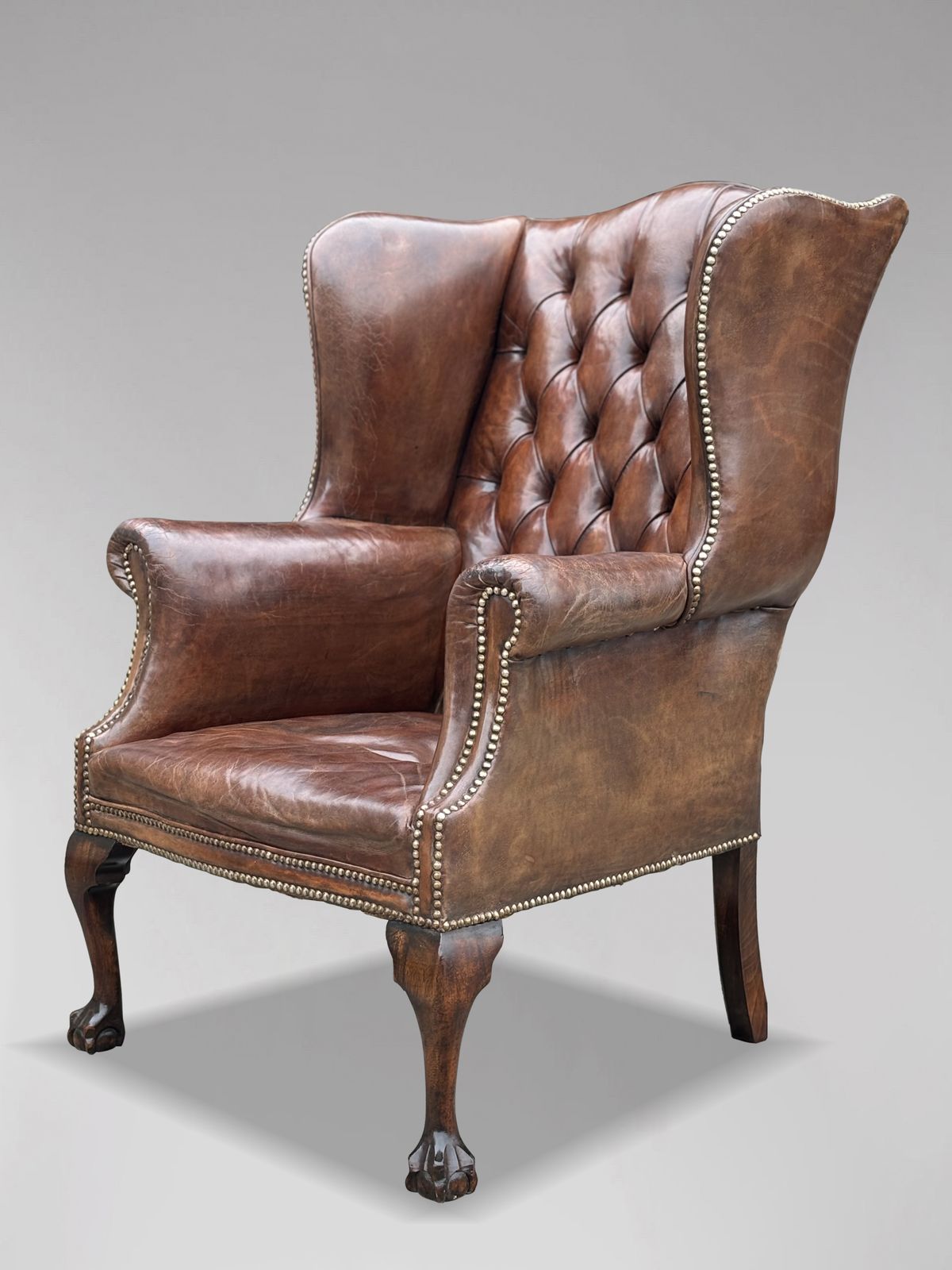 photo for sale 19th Century Brown Leather Wing Armchair