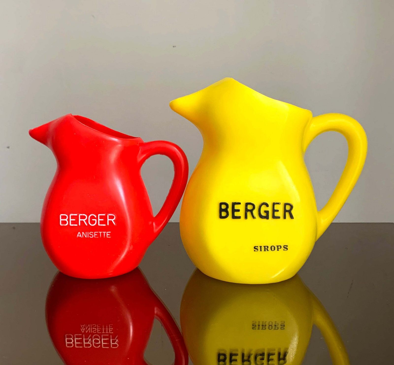 A Pair Of Vintage French Berger Anisette & Sirops Red & Yellow Plastic Jugs photo Home Decor