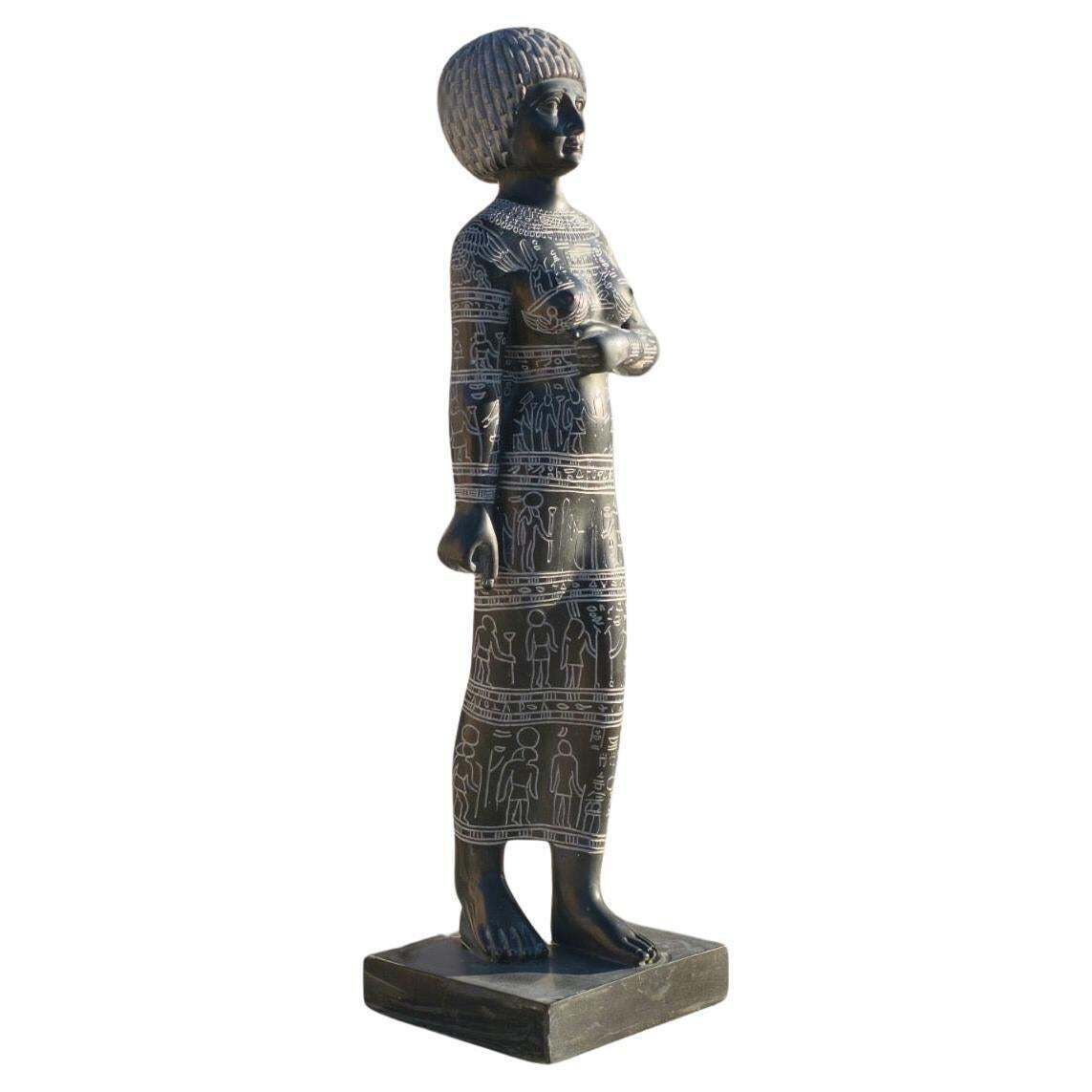 Black Marble Female Sculpture With Engraved Egyptian Hieroglyphs On Marble Base photo furniture