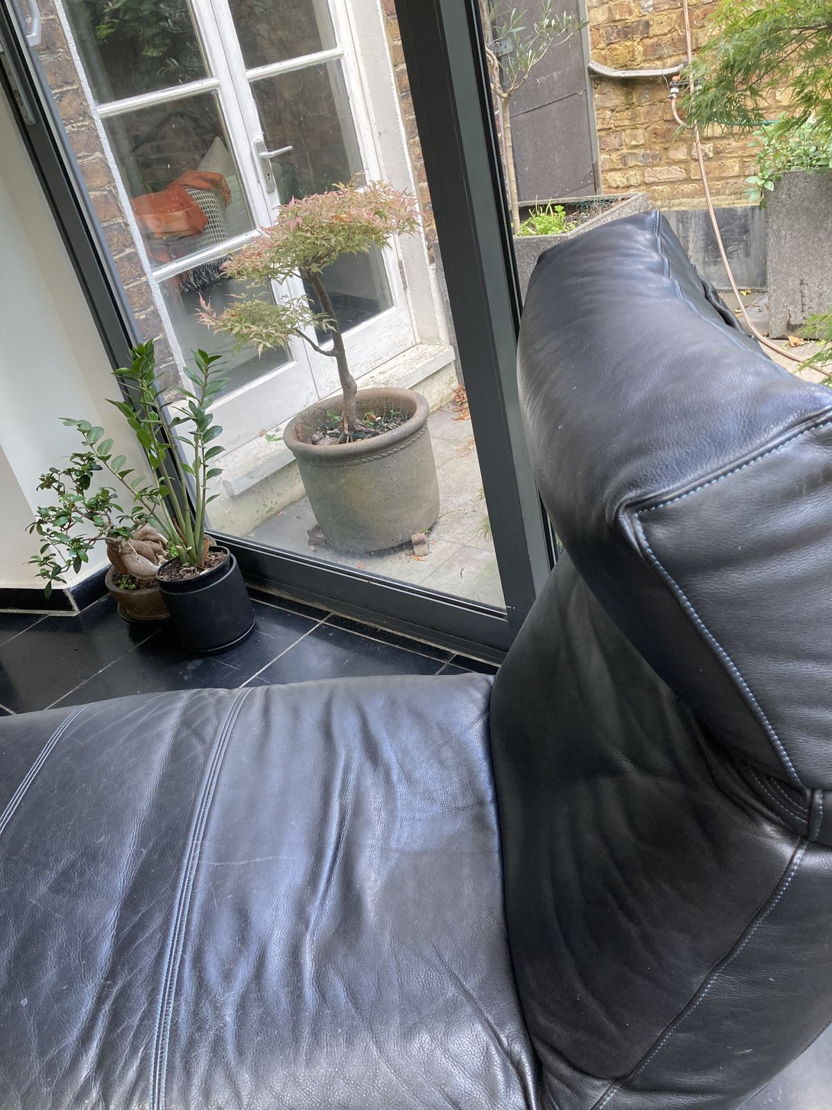 Eilerson Control Recliner. Dark Charcoal Leather. Heals. Exc. Condition. photo furniture