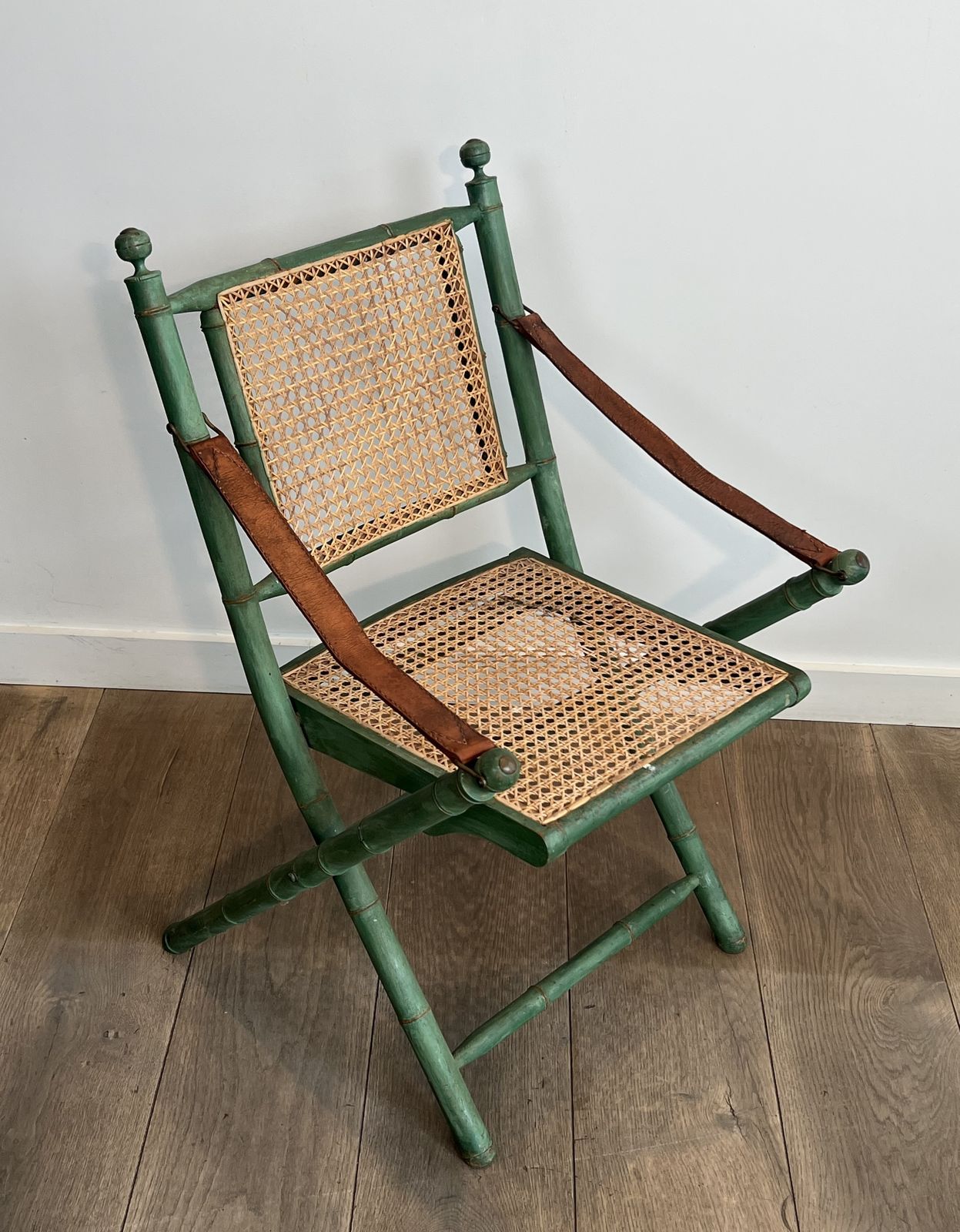 photo vinterior Pair Of Folding Safari Chairs In Weathered Faux Bamboo Style With Caned Backs And Seats And Leather Armrests
