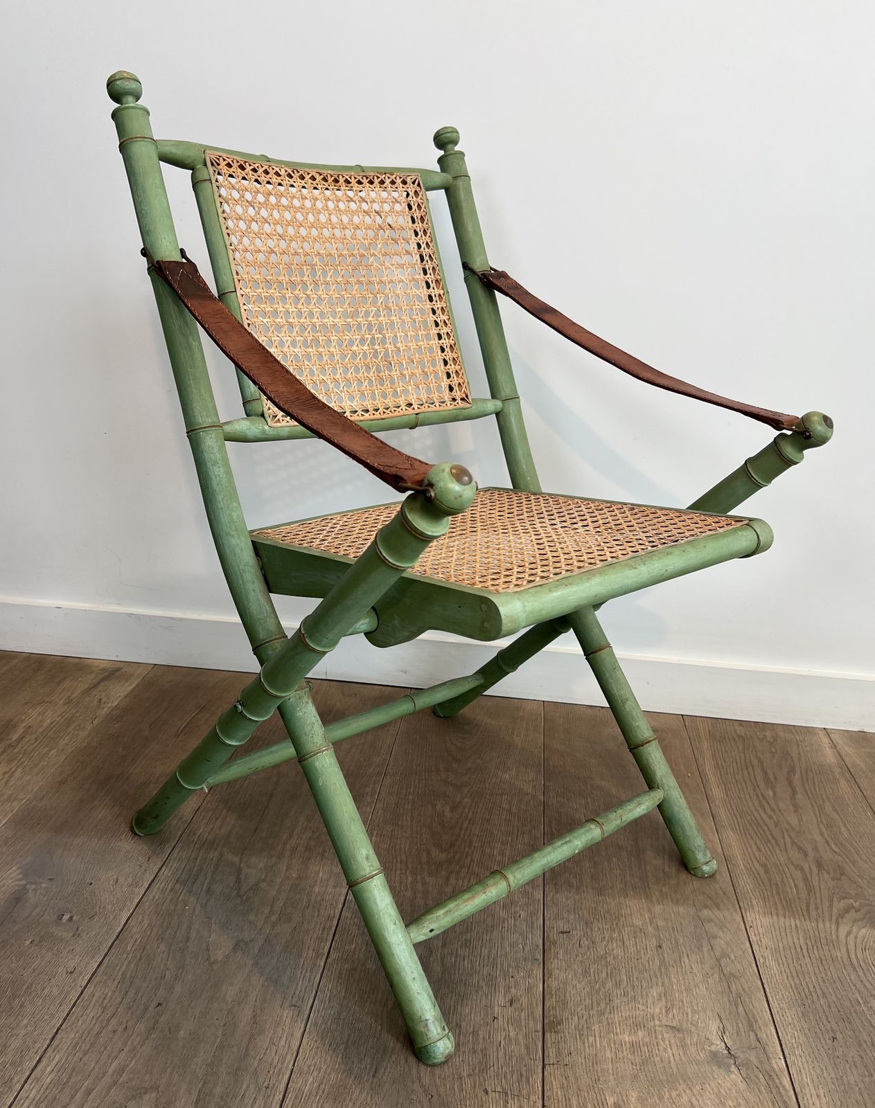 photo buy Pair Of Folding Safari Chairs In Weathered Faux Bamboo Style With Caned Backs And Seats And Leather Armrests