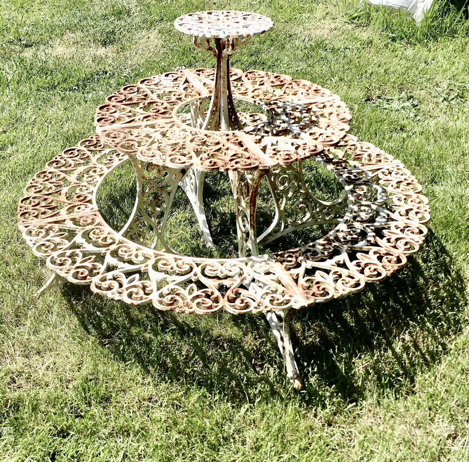 Round 3 Tier Weathered Cast Iron Plant Stand. photo vinterior