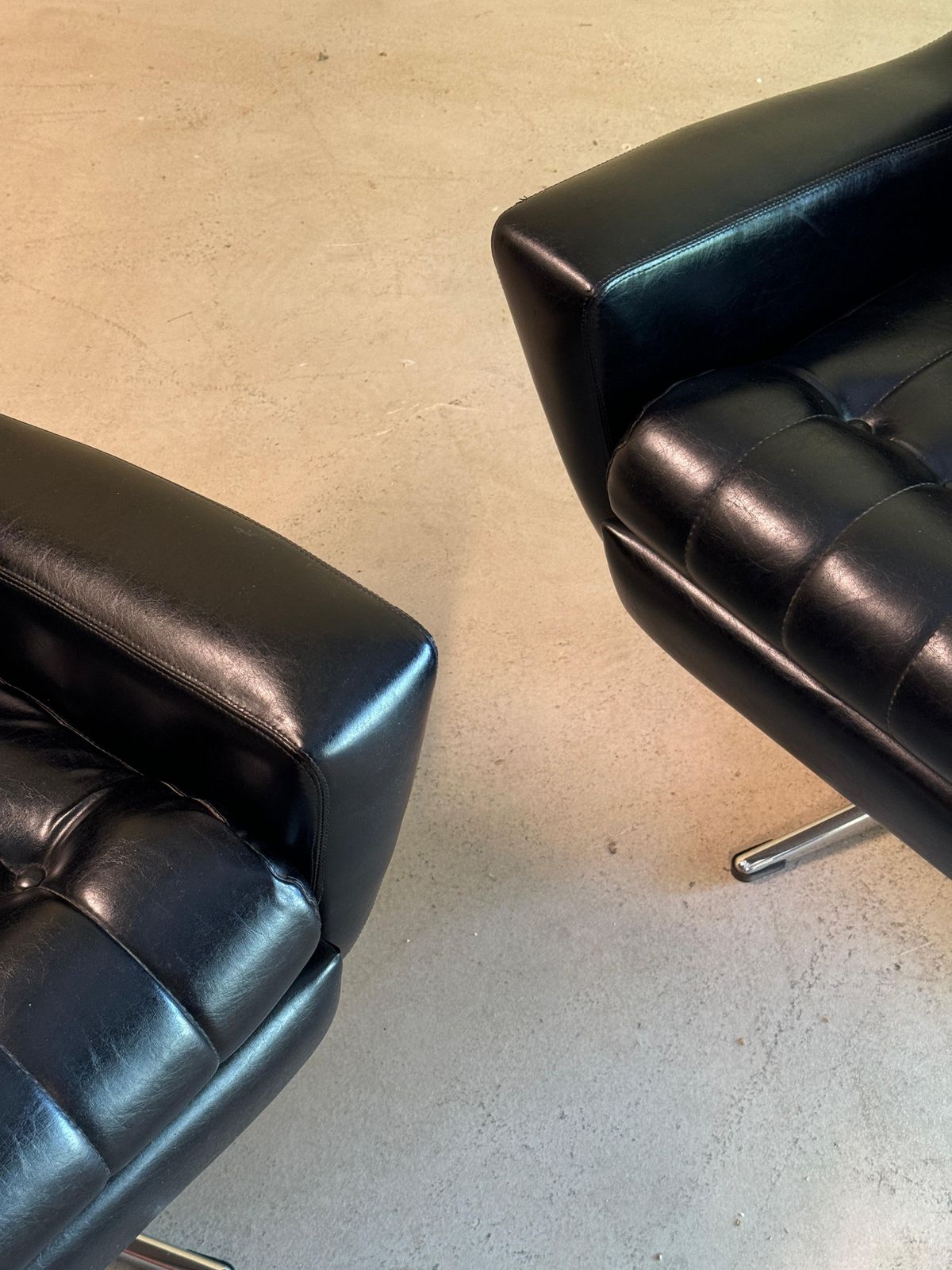 Furniture Vintage Pair Of Black Leather Swivel Easy Chairs photo