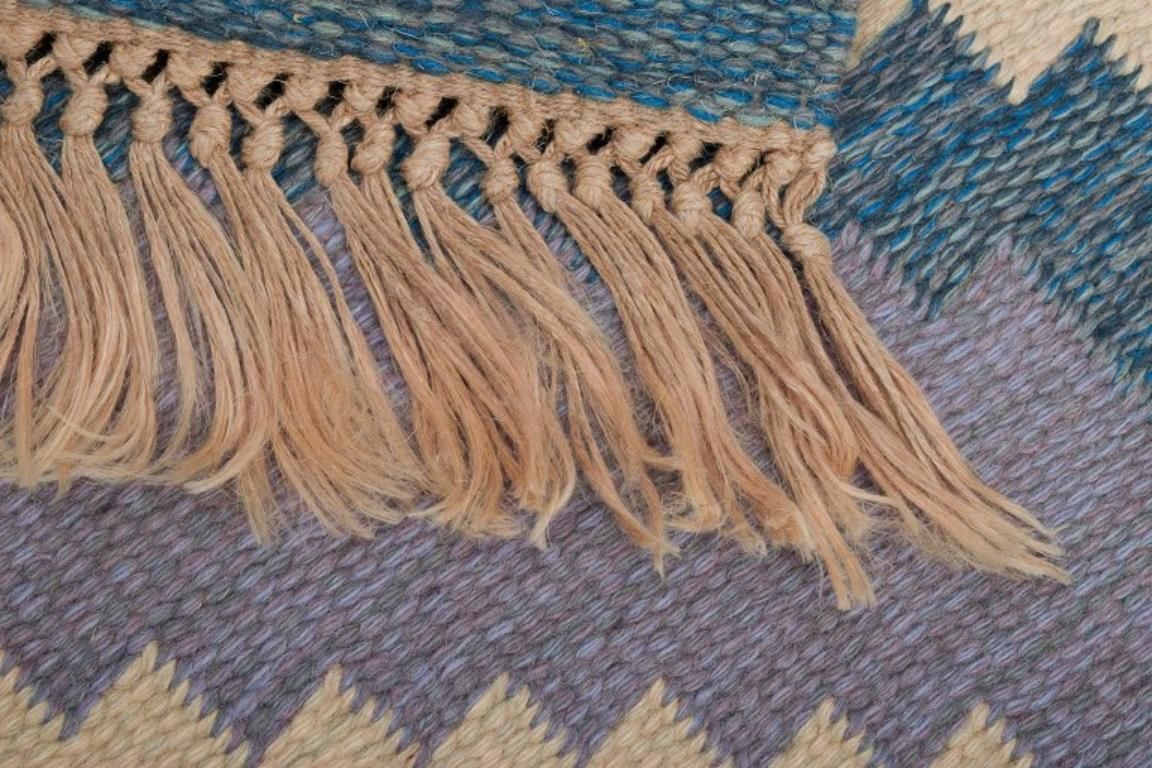 Swedish Carpet In Pure Wool. Geometric Pattern In Blue, White, And Pink Colors. photo vintage