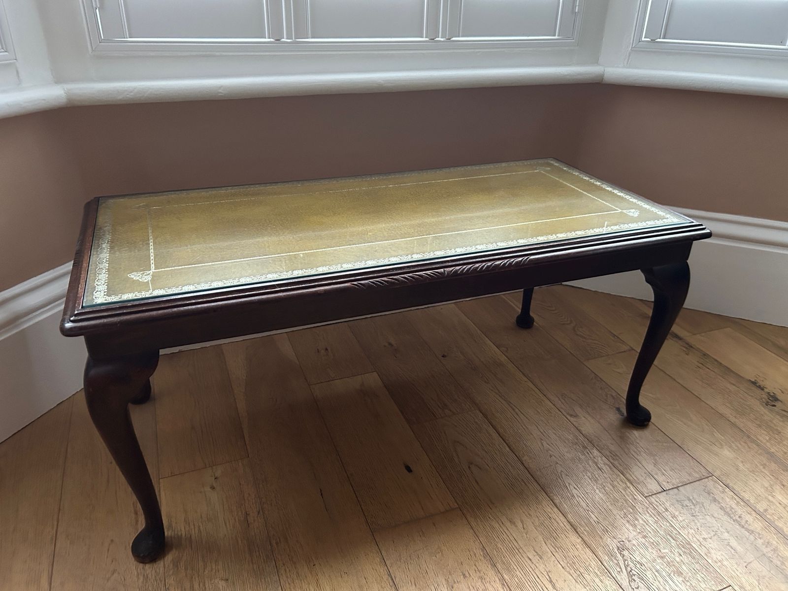 Beautiful Vintage Coffee Table With Queen Anne Carved Legs, Unusual Mustard Leather Inlay And Tempered Glass Top.