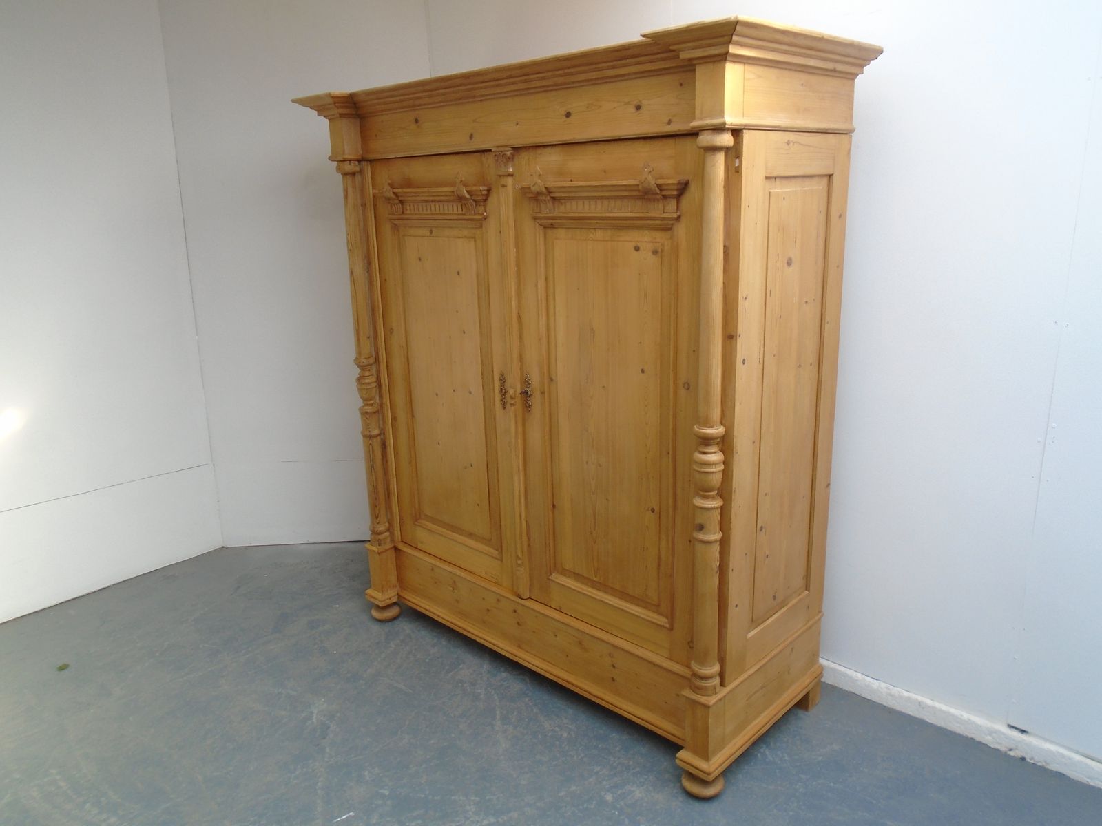 A Fantastic Large Columned Pine Waxed Victorian Knockdown Wardrobe