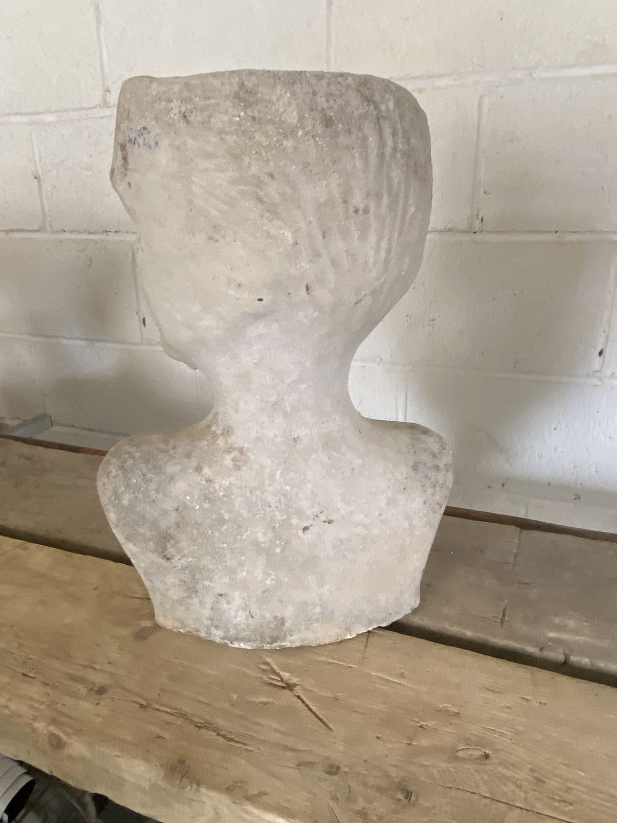 A Garden Sculpture Of Head. photo 75.0