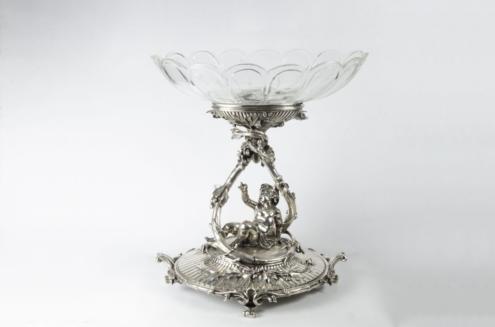 Late 19th Century Christofle Rococo Revival Silvered Metal Decorative Centerpiece Of Reclining Child With Baccarat Cut Crystal Compote Bowls, France
