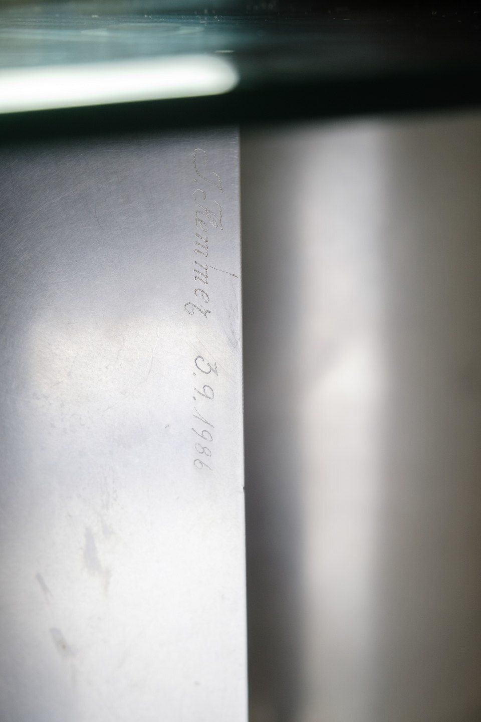 photo furniture Unique Coffee Table With Glass Top & Frame Shaped In Steel By Jørgen Flemmer & Signed J.Flemmer 3.9.1986  From 1986s