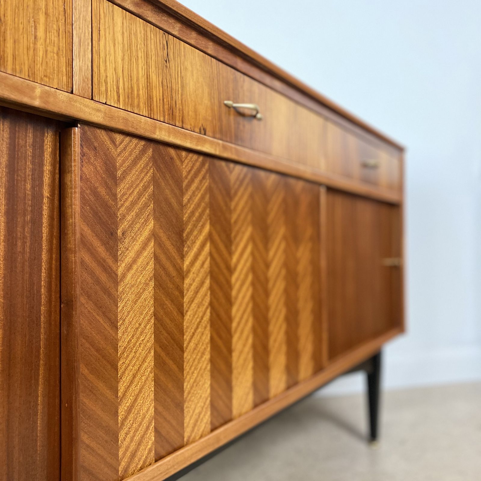photo buy Mid Century Sideboard By Jentique In Teak Rosewood Tola With Black And Gold Chevron Design And Light