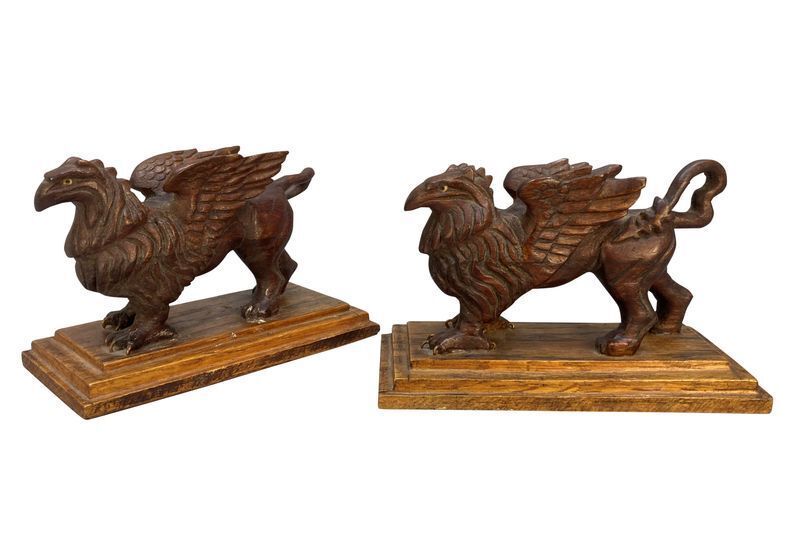 A Pair Of Carved Griffins On Plinths photo furniture