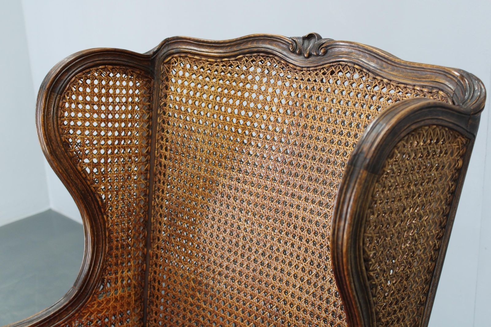 Furniture Antique Carved Wing Chair With Cane Sides , Czechoslovakia photo