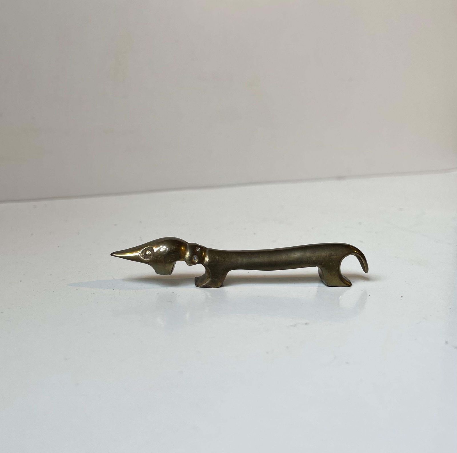 "Noodle" Dachshund Brass Dog Bottle Opener By Bosse Vienna Austria, 1950s photo for sale