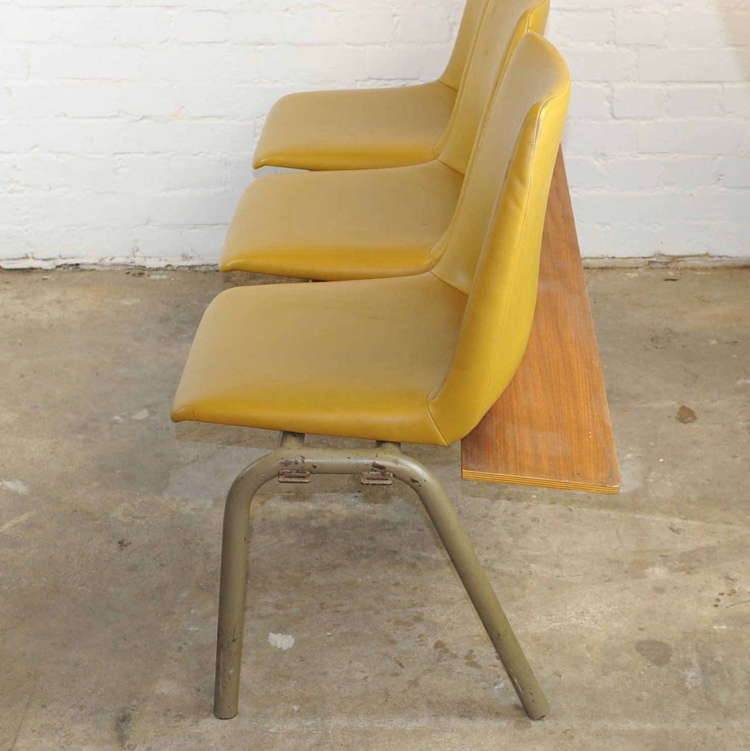 Furniture Conjoined Yellow Vinyl Chairs On Black Legs, Set Of 3, 1980s photo