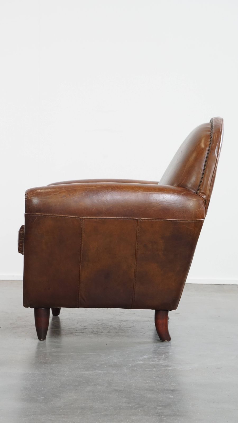Characterful And Timeless Cowhide Design Armchair With Beautiful Round Shapes And Decorative Nails photo 1022.6351999999999