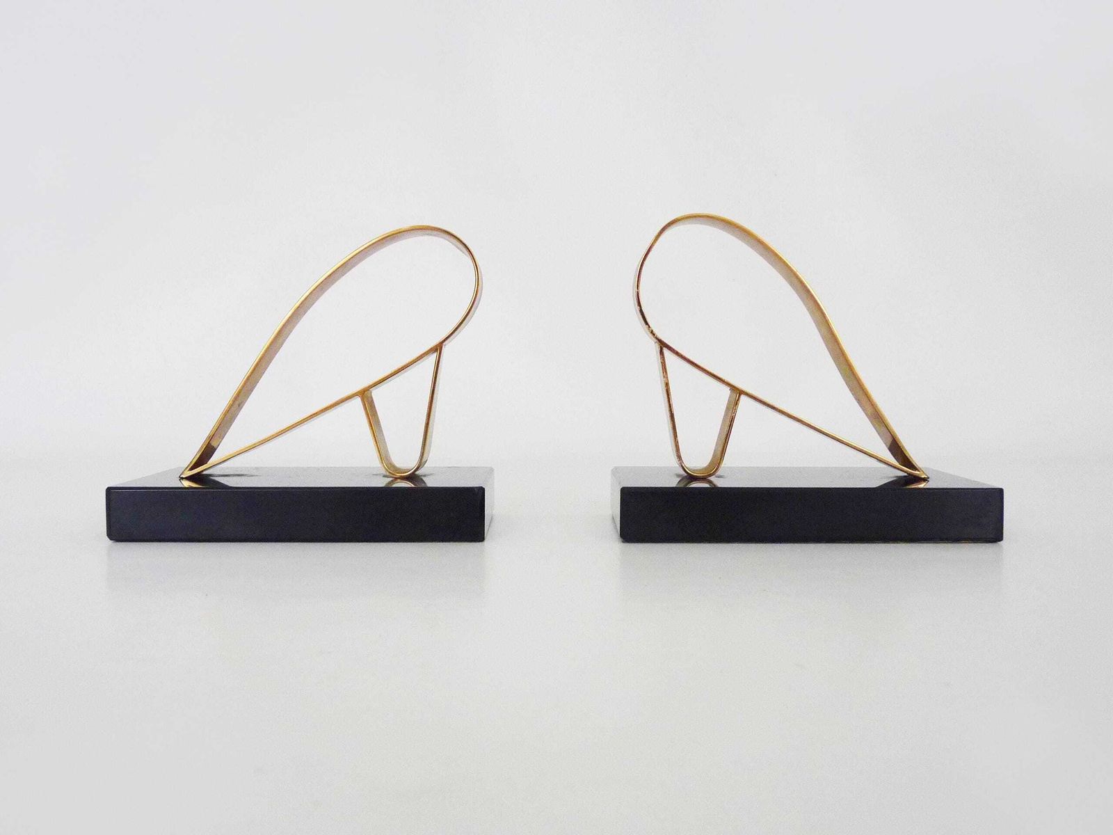 Pair Of Modernist Art Deco Gold Starry Bookends On A Black Marble Base.