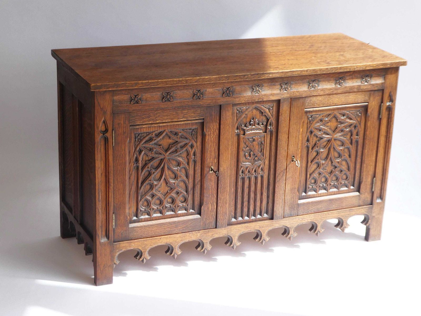 Antique Gothic Wooden Credenza, Hand Carved Cabinet With Doors And Lock, 19th Century Medieval Cupboard With Lion And Church Window Panels photo furniture