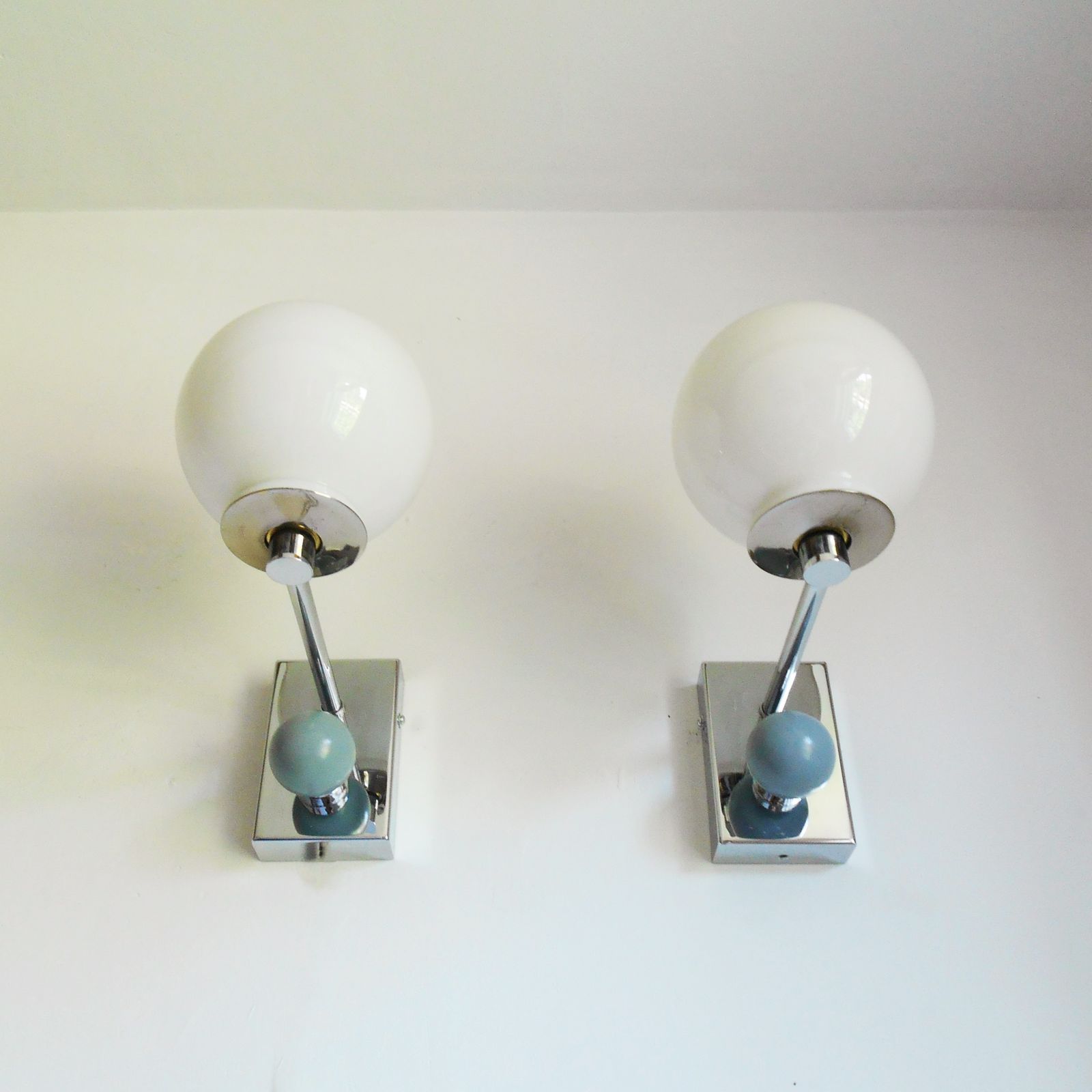A Pair Of Unique Silver Chrome Wall Lamps With White Glass Globe Shades photo for sale