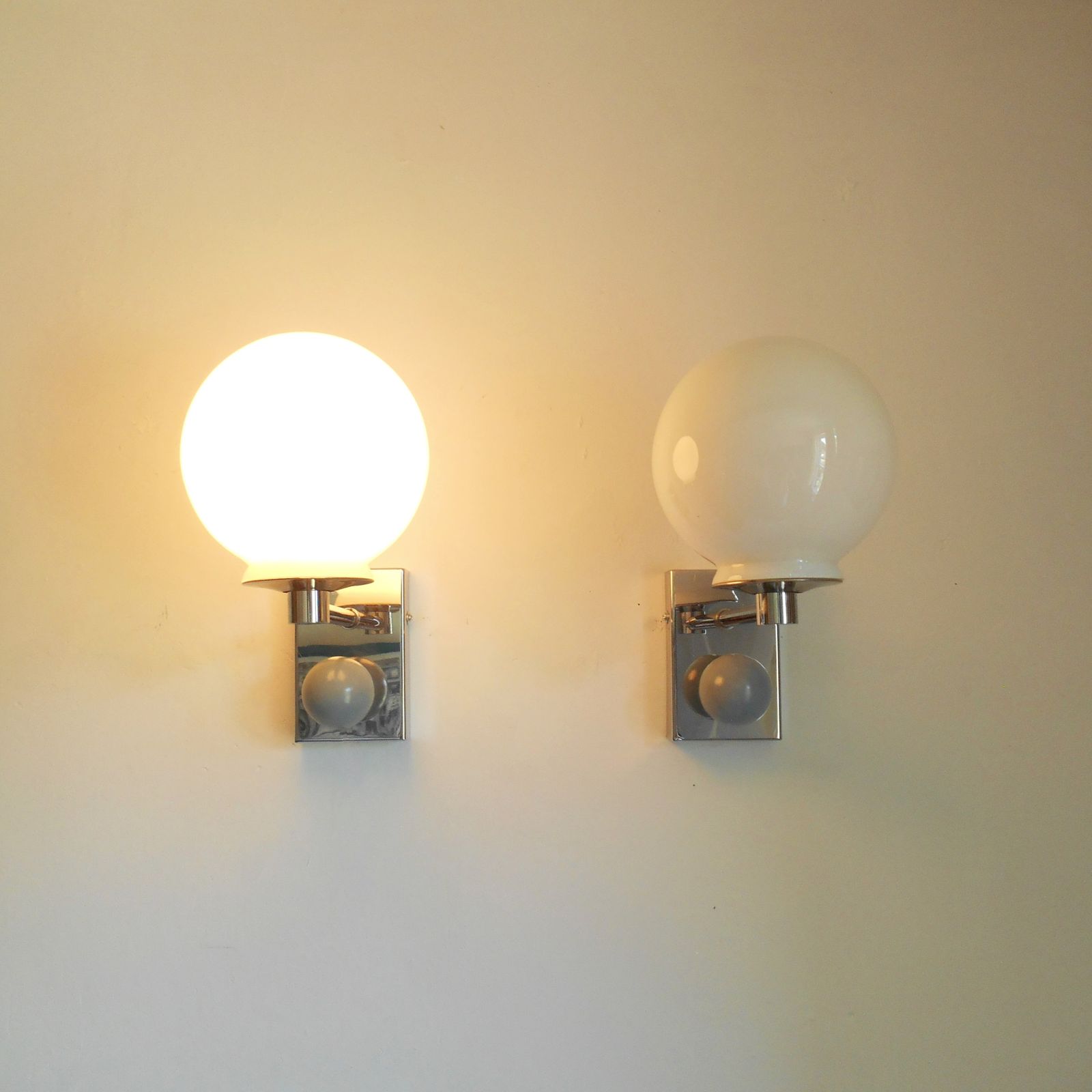 A Pair Of Unique Silver Chrome Wall Lamps With White Glass Globe Shades photo vinterior