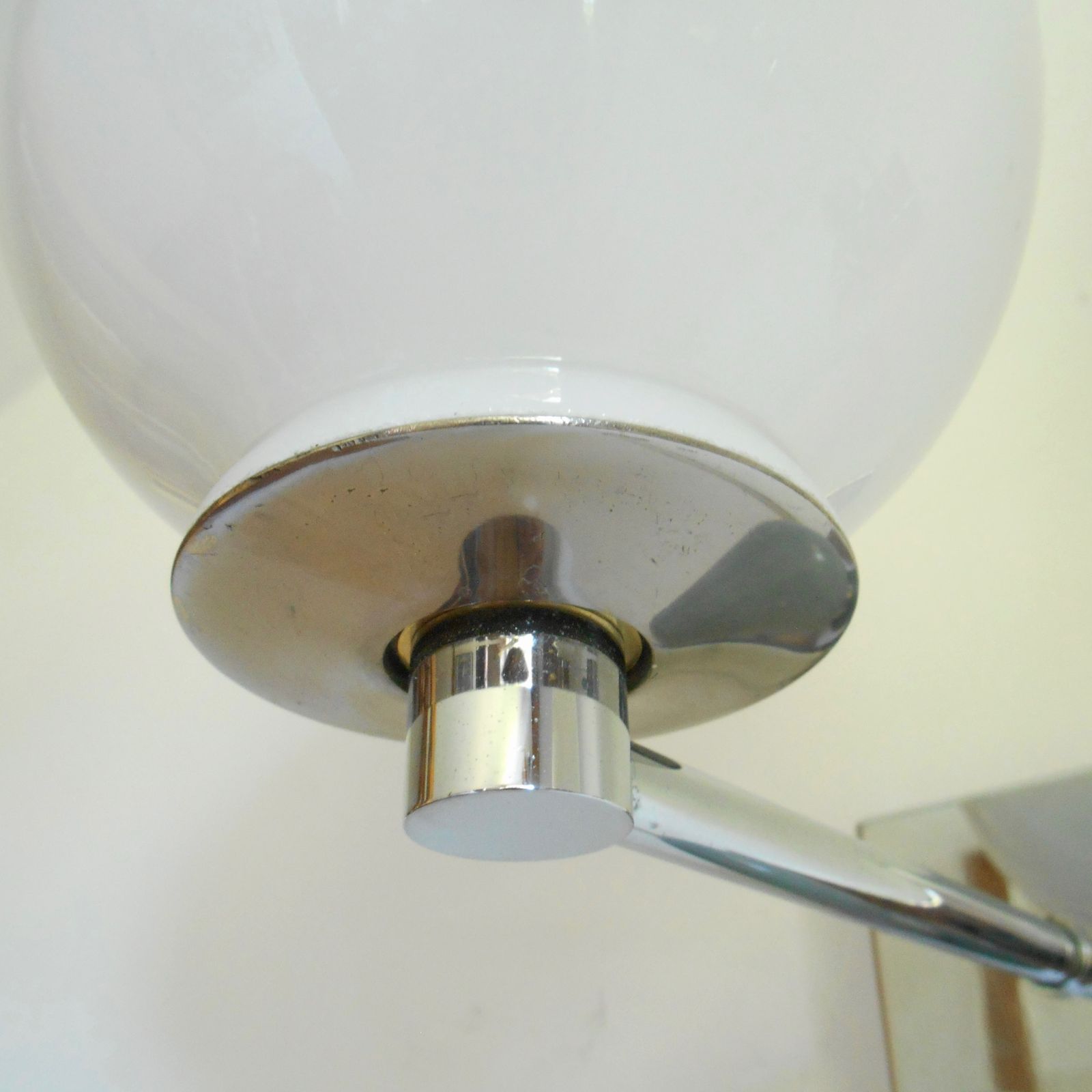 photo furniture A Pair Of Unique Silver Chrome Wall Lamps With White Glass Globe Shades
