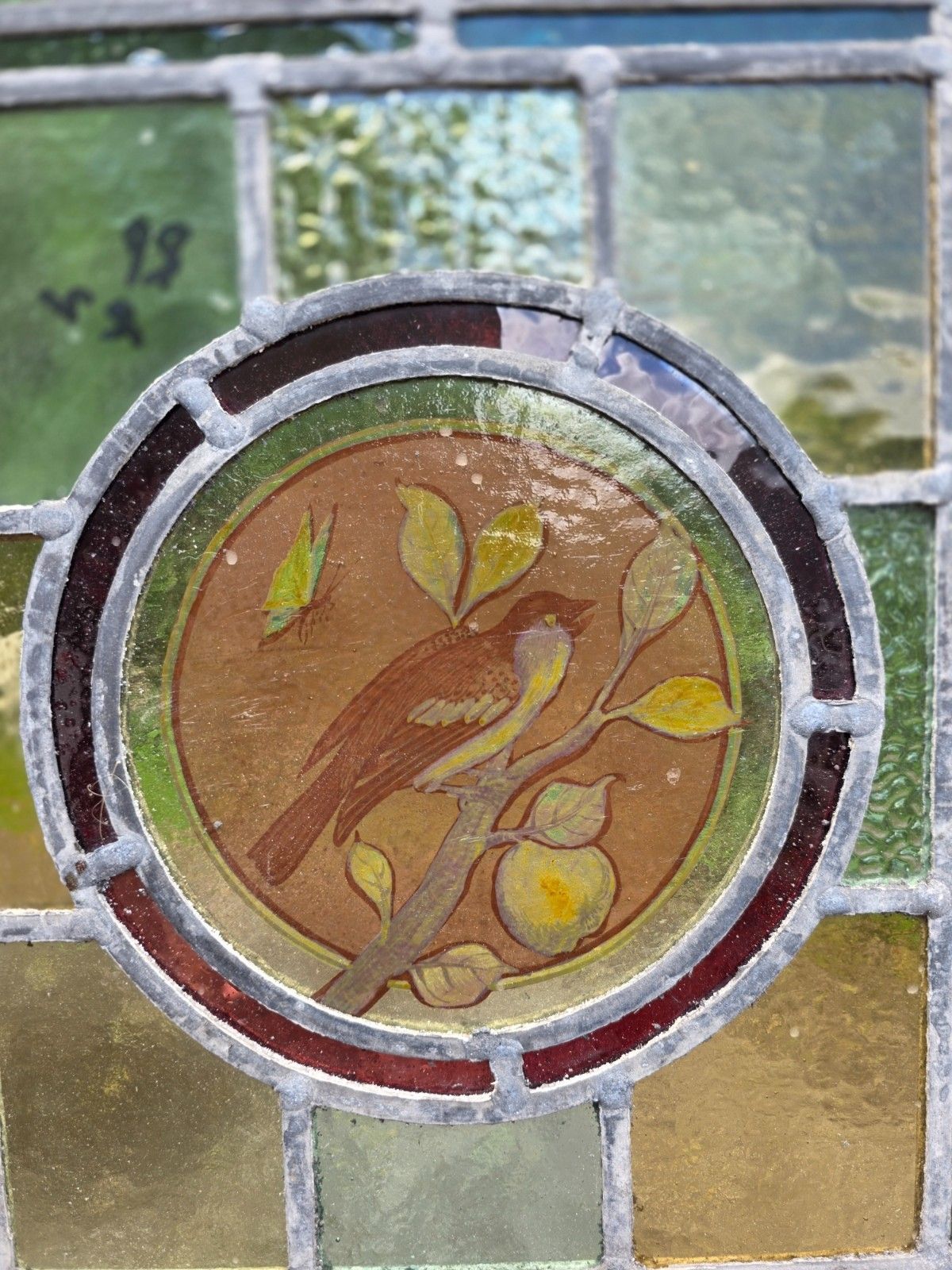 1910 Antique Leaded Glass Window With Bird On A Branch Design photo Art