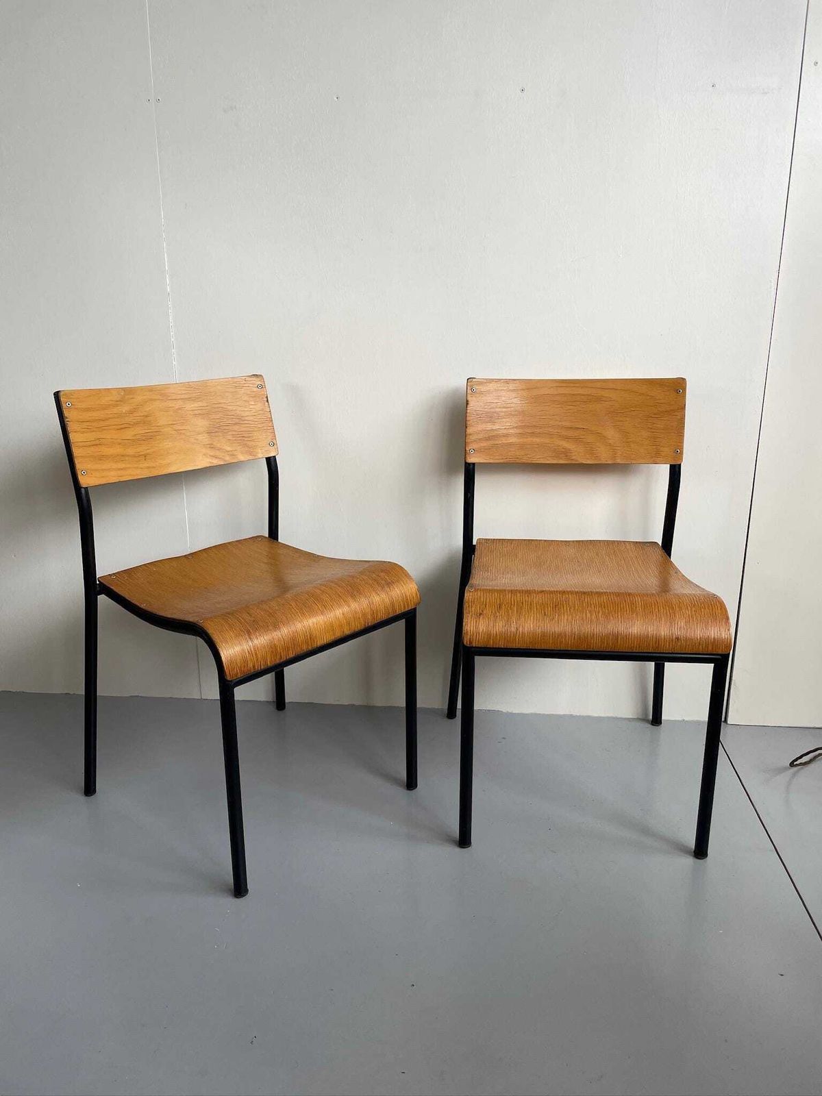 Pair Of Vintage Industrial Metal Stacking Dining Chairs With Bent Plywood Seats By Shepherd