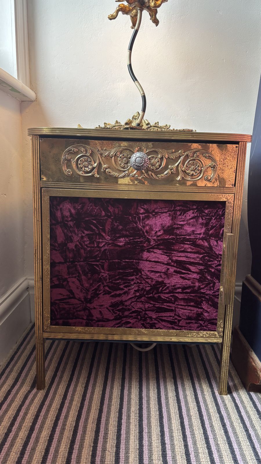 Mid Century Bronze Nightstand With Black Vitrine Glass Top And Velvet Side Panels And Door