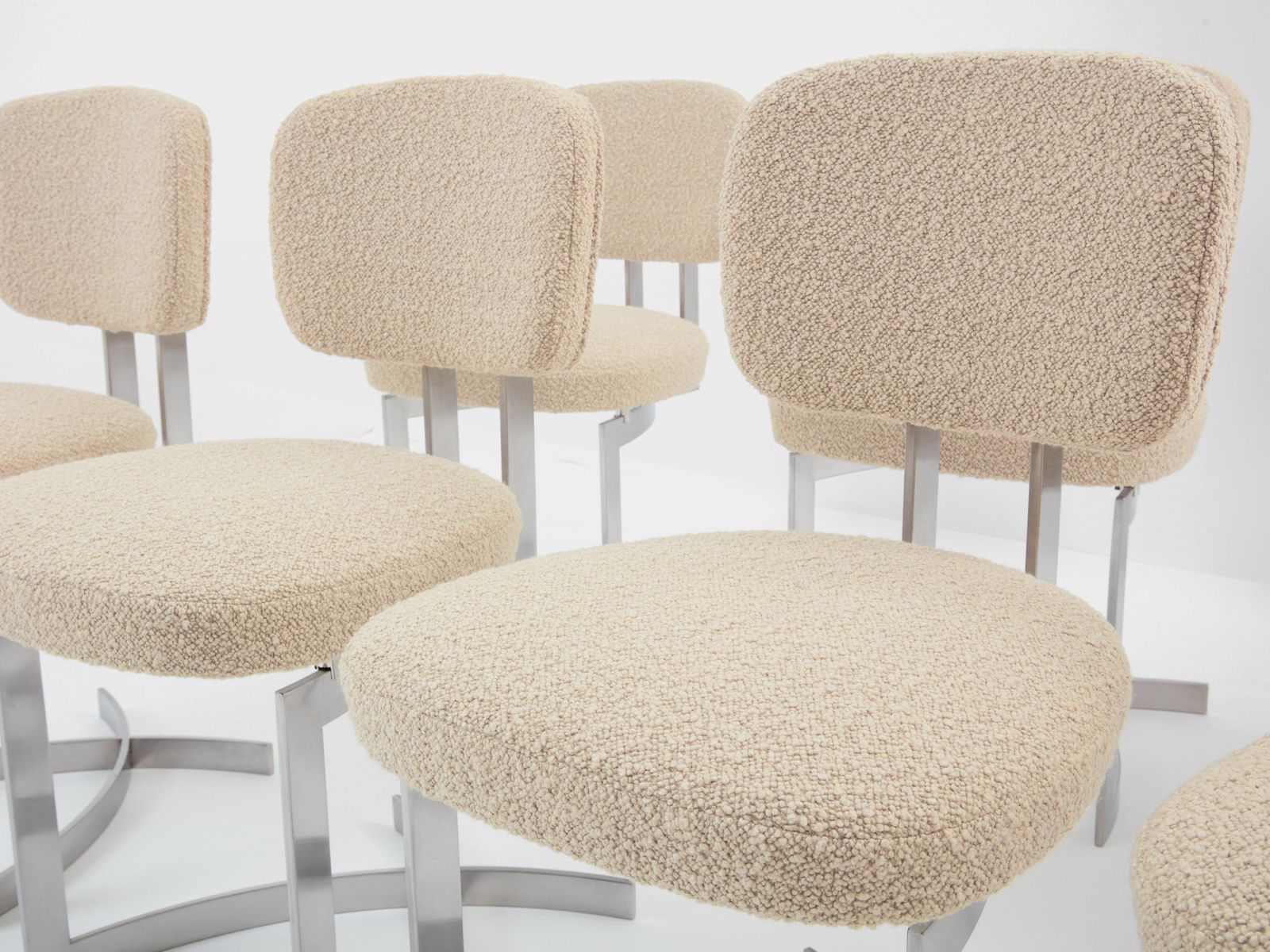 Ensemble de douze chaises Paul Legeard en acier inoxydable et laine bouclé, 1970 photo for sale