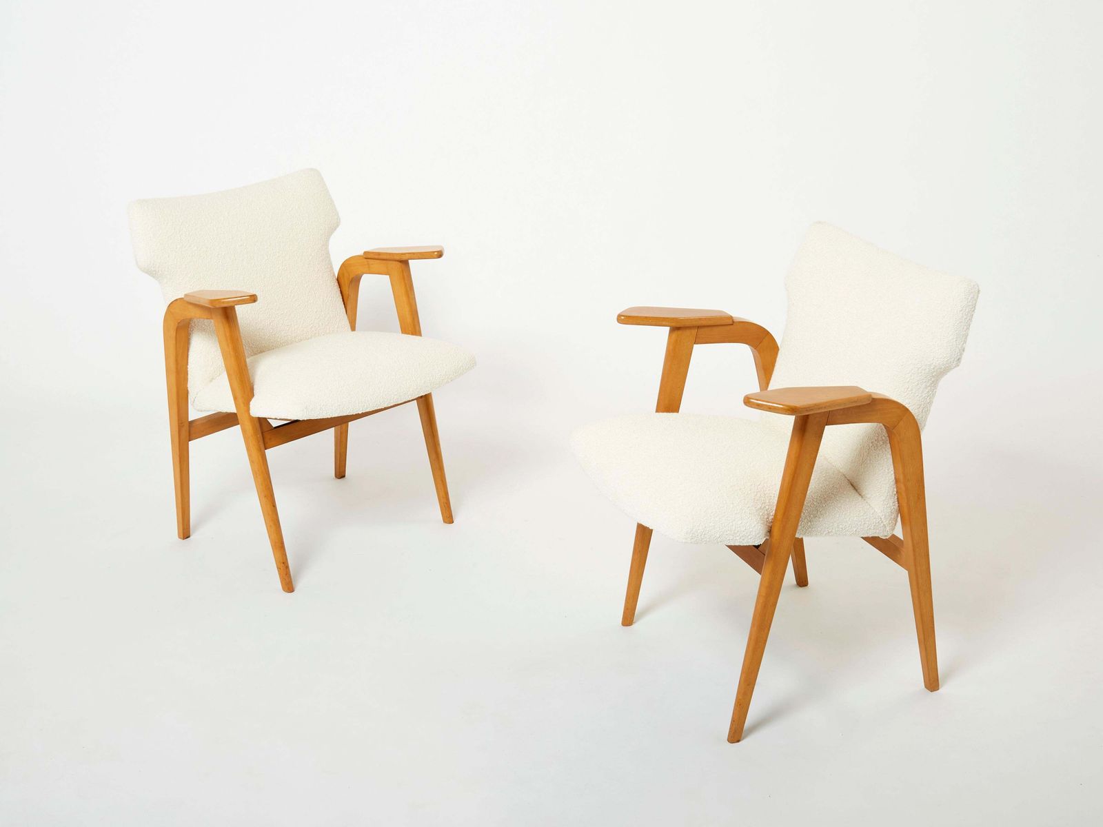 Fauteuils à pieds compas en chêne massif et bouclé de laine, par Roger Landault, années 1950 photo for sale