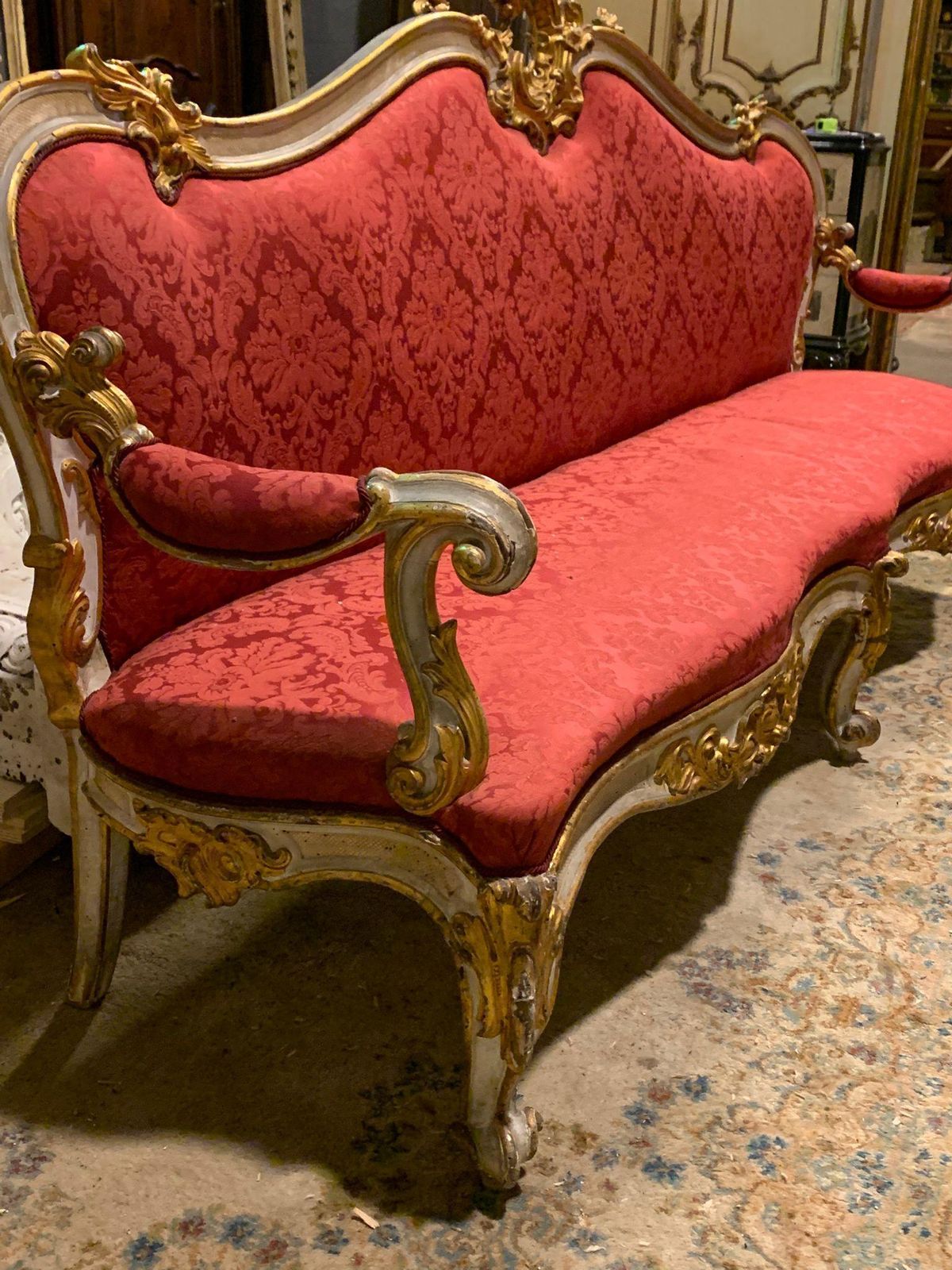 photo for sale Pair Of Lacquered Gilded Carved Sofas, Upholstered In Red Brocade, Italy