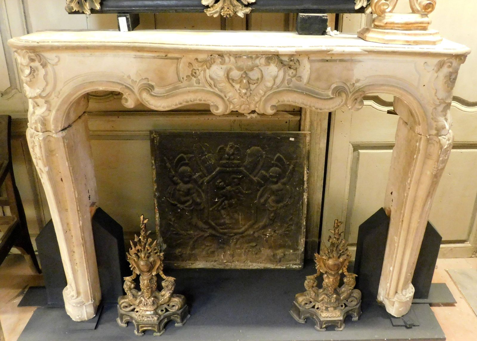 Fireplace Mantle In Richly Carved Burgundy Stone And Wavy Shape, Italy photo vinterior