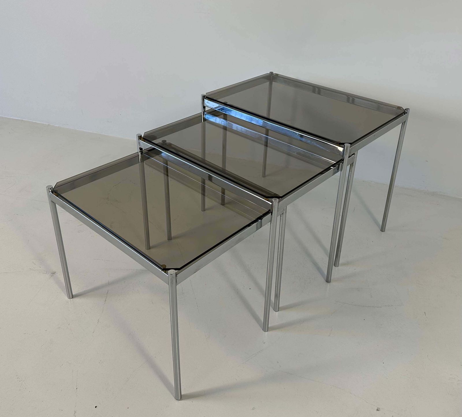 Italian Midcentury Set Of Three Chromed Metal Glass Stackable Tray Tables, 1970s photo for sale