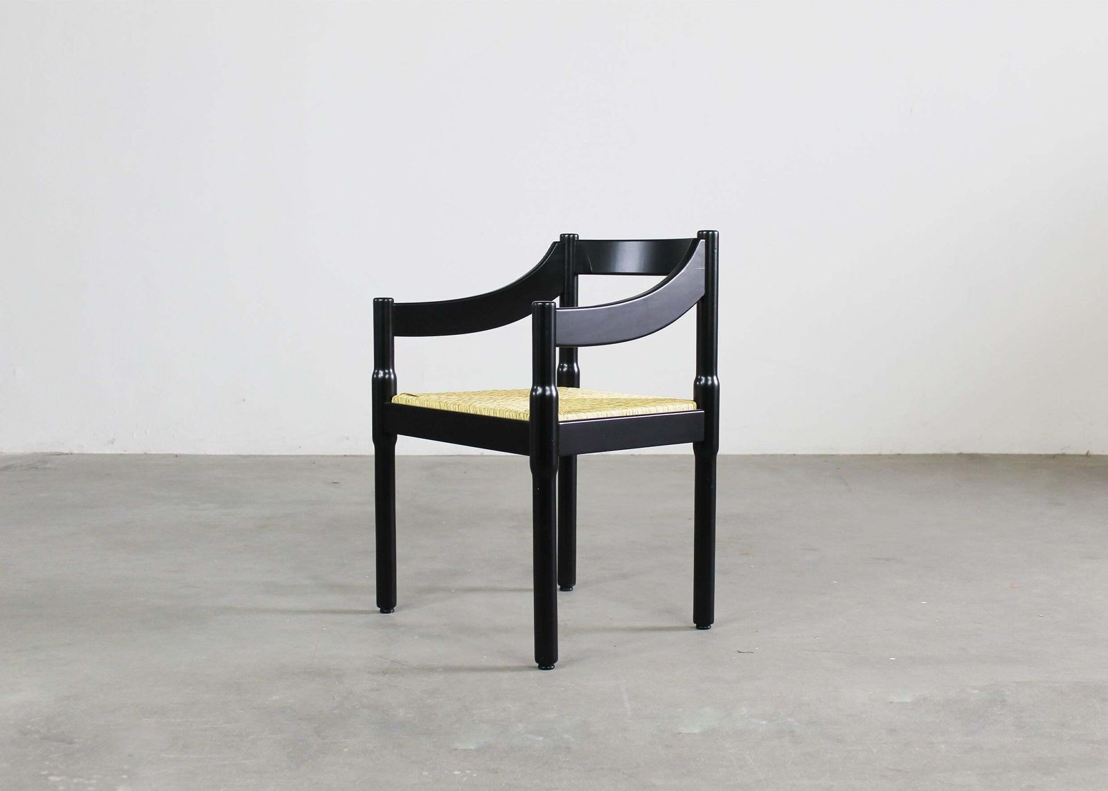 photo buy Vico Magistretti Set Of Twelve Black Carimate Chairs By Cassina 1960s